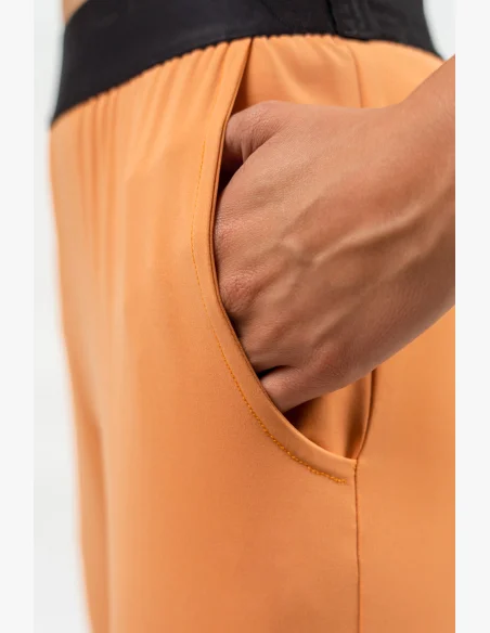 NEBBIA • Slim fit legíny s kapsami GYM SPIRIT oranžová • Nebshop.cz